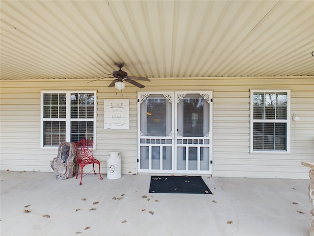 view of patio / terrace featuring ceiling fan and french doors