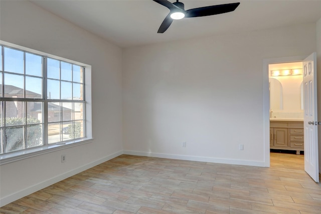 unfurnished room with ceiling fan