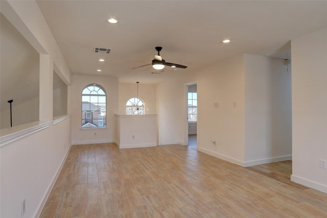 unfurnished room with light hardwood / wood-style floors and ceiling fan