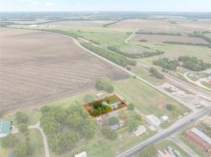 birds eye view of property with a rural view