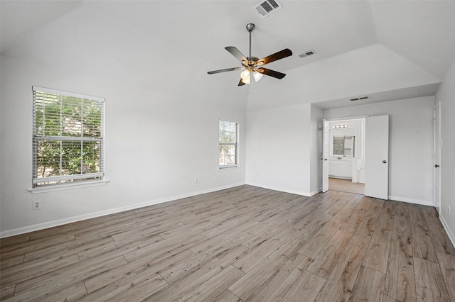 interior space with a healthy amount of sunlight, light hardwood / wood-style flooring, high vaulted ceiling, and ceiling fan