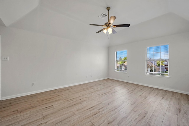 unfurnished room featuring ceiling fan, vaulted ceiling, and light hardwood / wood-style floors