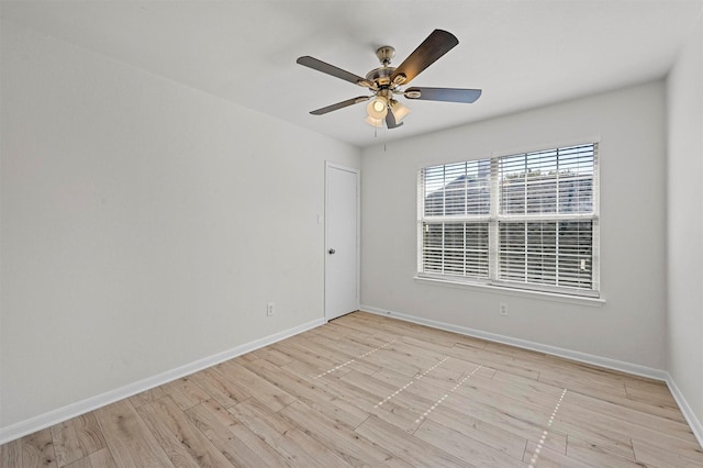 spare room featuring light wood-type flooring and ceiling fan