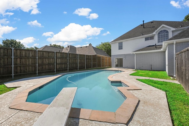 view of pool featuring a diving board