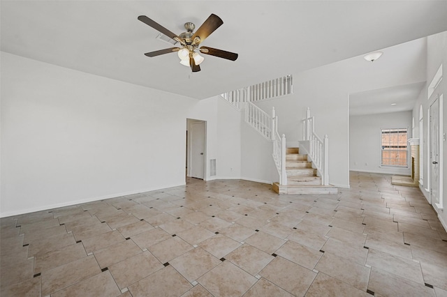 unfurnished living room with ceiling fan