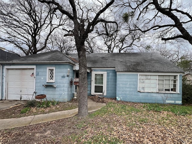 single story home featuring a garage