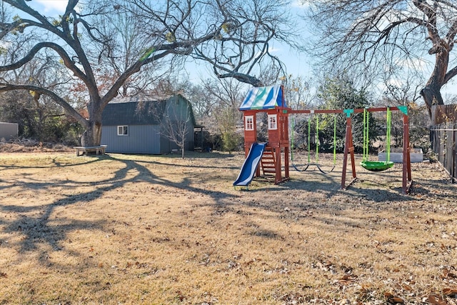 view of play area with a shed and a lawn