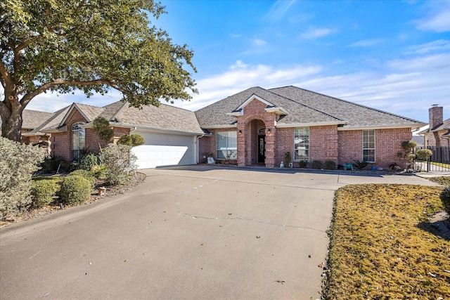 ranch-style home featuring a garage