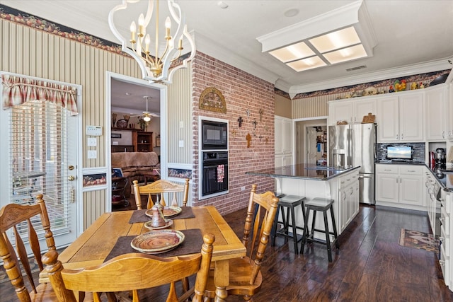 dining room with ornamental molding, brick wall, ceiling fan, and dark hardwood / wood-style flooring