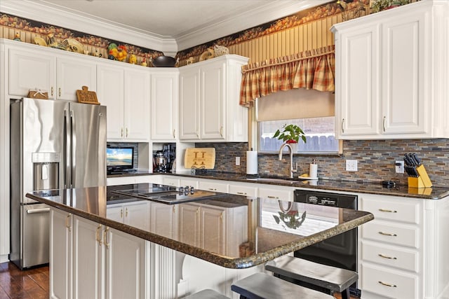 kitchen featuring sink, a center island, white cabinets, and stainless steel refrigerator with ice dispenser