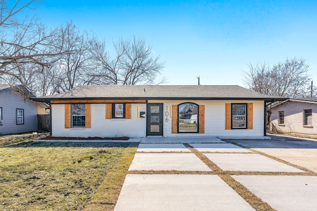 ranch-style house with a front yard