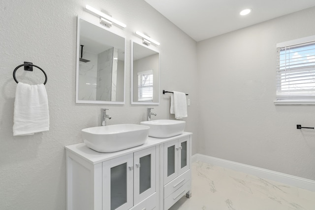 bathroom featuring vanity and a shower