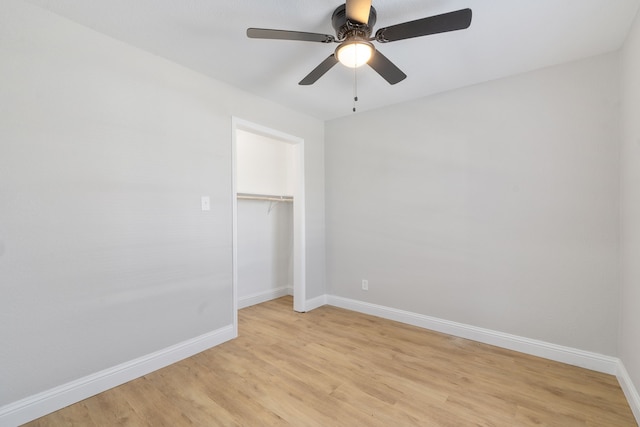 unfurnished room featuring light hardwood / wood-style floors and ceiling fan