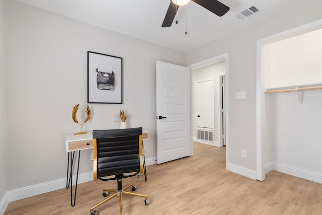 home office featuring ceiling fan and light hardwood / wood-style floors