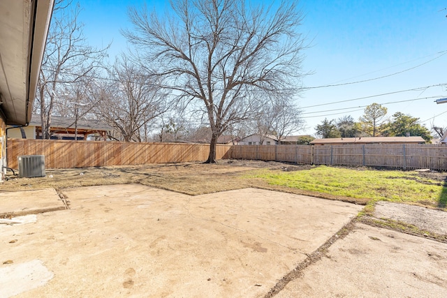 view of yard featuring cooling unit and a patio