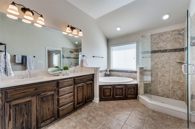 bathroom featuring plus walk in shower, tile patterned flooring, lofted ceiling, and vanity