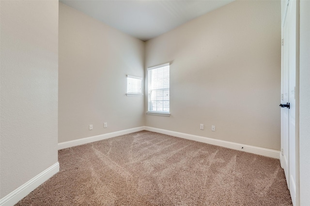 empty room featuring carpet flooring