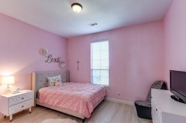 bedroom featuring light wood-type flooring