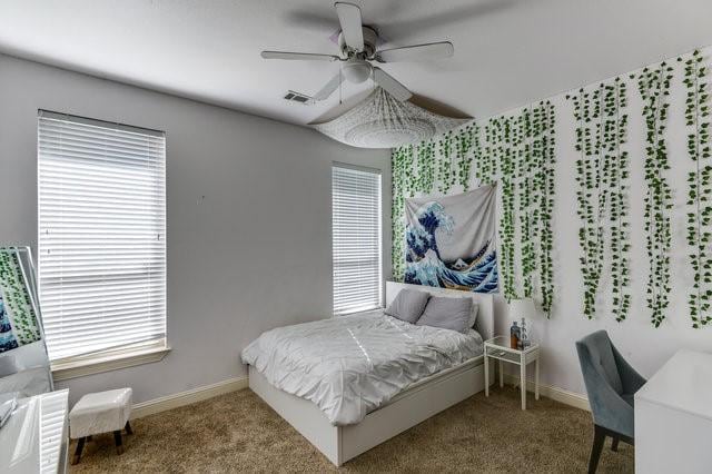 bedroom featuring ceiling fan and carpet flooring