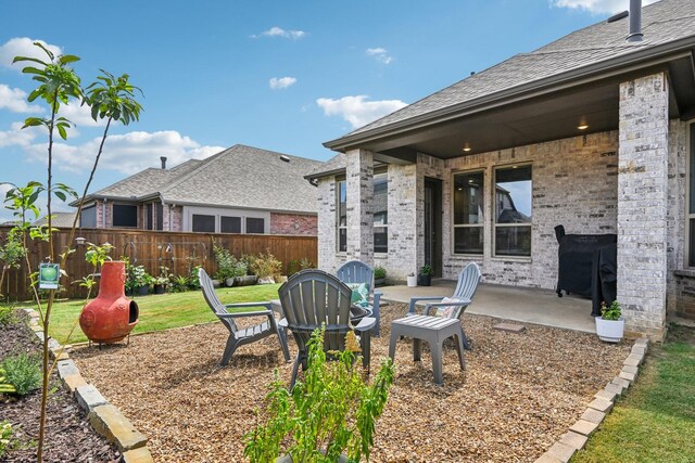 view of yard featuring a patio and a fire pit