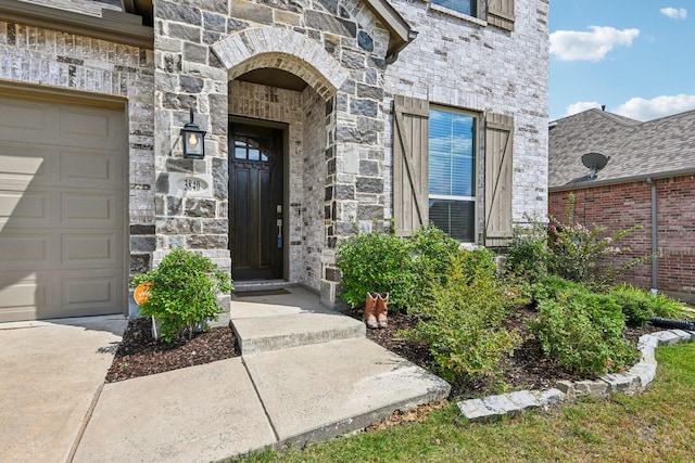 doorway to property featuring a garage