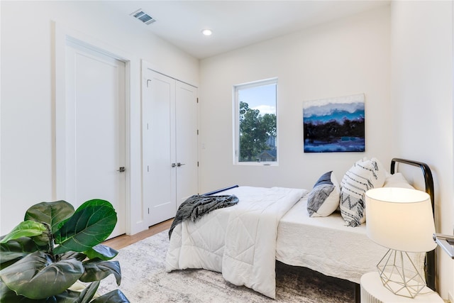 bedroom with hardwood / wood-style flooring