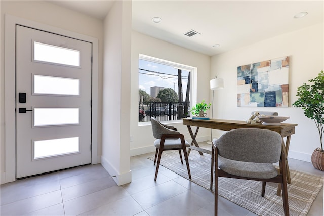 office space with light tile patterned floors