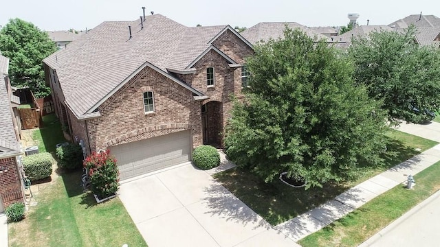 view of front of house with a garage and a front yard