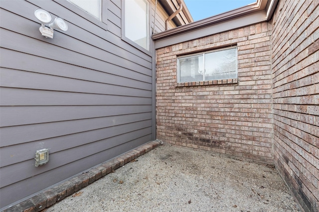 view of side of home with a patio