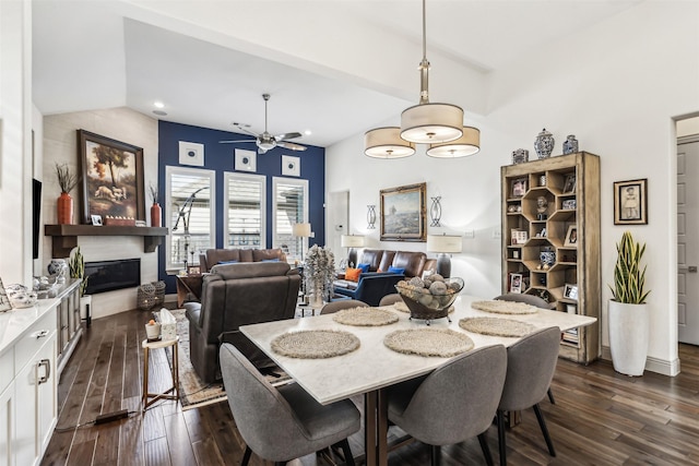 dining area with ceiling fan and dark hardwood / wood-style flooring