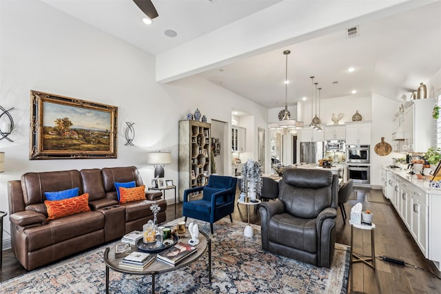 living room featuring beam ceiling, ceiling fan, and dark hardwood / wood-style flooring