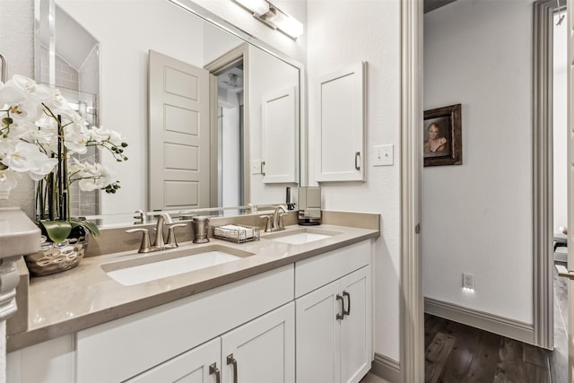 bathroom featuring wood-type flooring and vanity