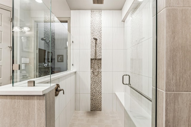 bathroom with a shower with shower door