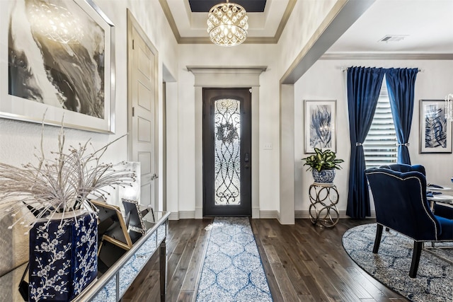 foyer featuring dark hardwood / wood-style floors and a notable chandelier