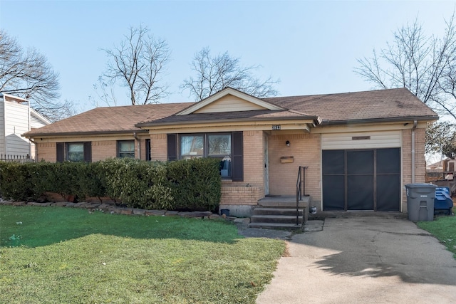 ranch-style house featuring a garage and a front lawn