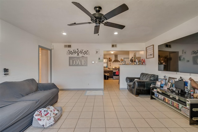 tiled living room with ceiling fan