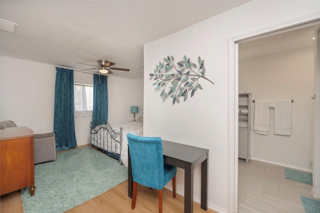 bedroom with light hardwood / wood-style floors and ceiling fan