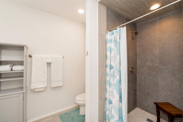 bathroom with toilet and a shower with shower curtain