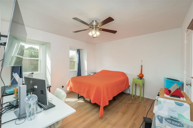 bedroom featuring ceiling fan and light hardwood / wood-style flooring