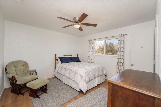 bedroom featuring ceiling fan and wood-type flooring