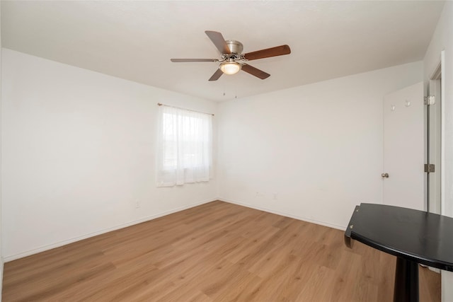 spare room with ceiling fan and light hardwood / wood-style flooring