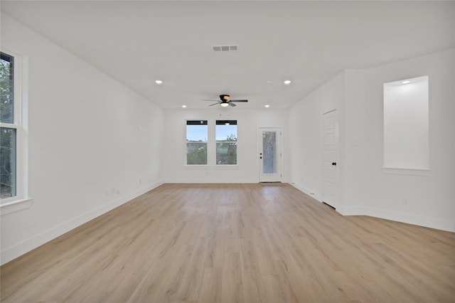 spare room with light hardwood / wood-style floors and ceiling fan