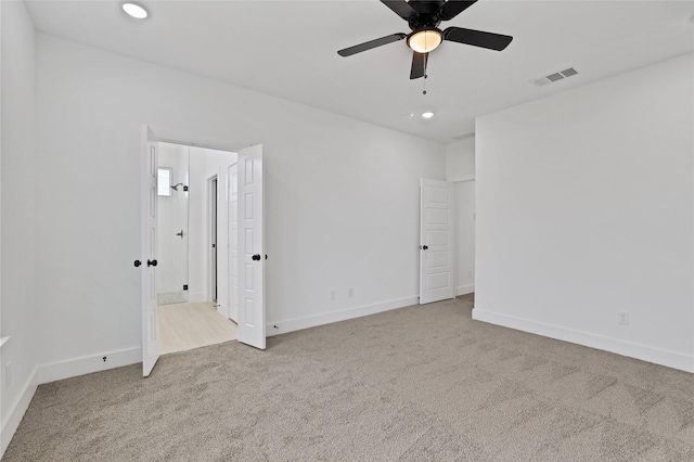 carpeted empty room with ceiling fan