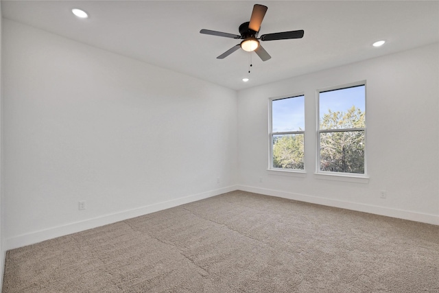 empty room with ceiling fan and carpet flooring