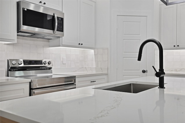 kitchen with white cabinets and stainless steel appliances