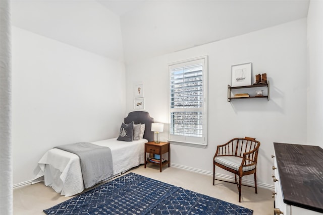 carpeted bedroom featuring baseboards