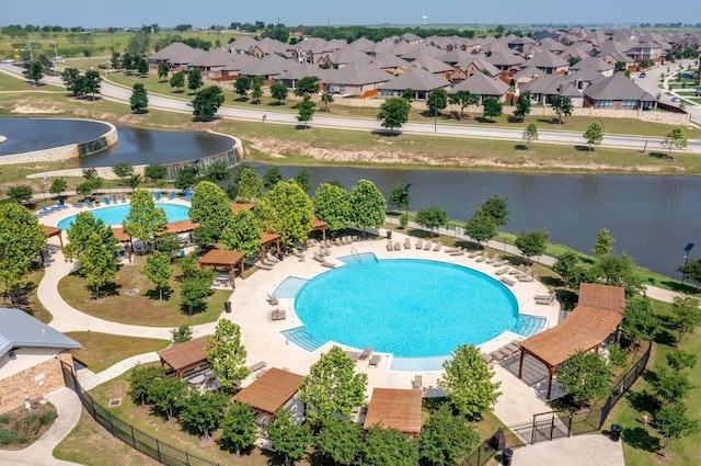 view of pool featuring a water view