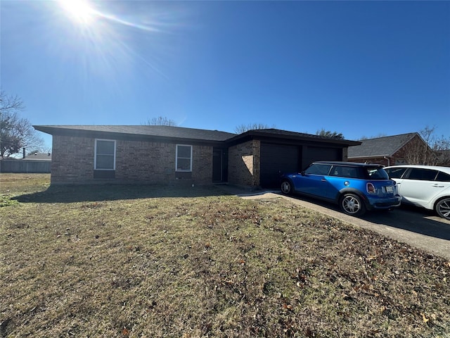 view of front of home with a garage and a front yard