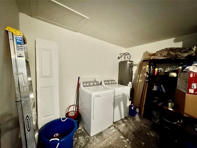 laundry room with water heater and washing machine and clothes dryer