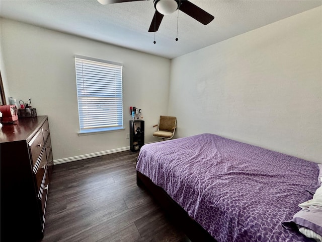 bedroom featuring ceiling fan and dark hardwood / wood-style floors